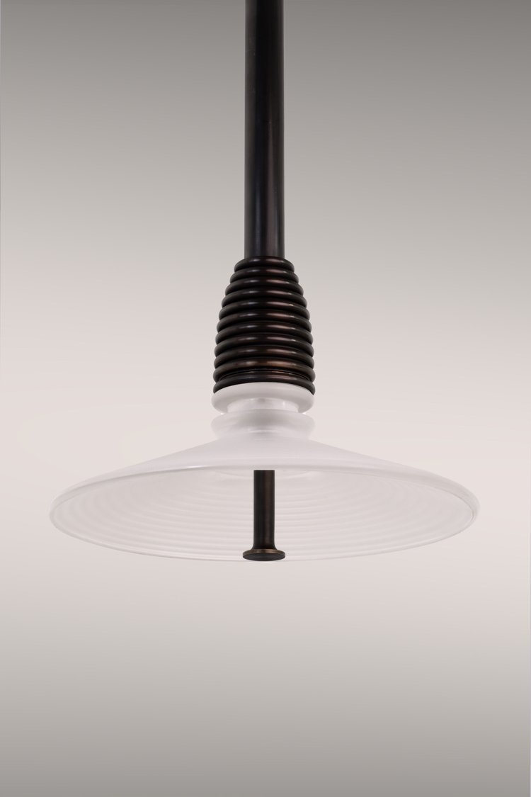 Pendant light in dark brass, frosted glass.